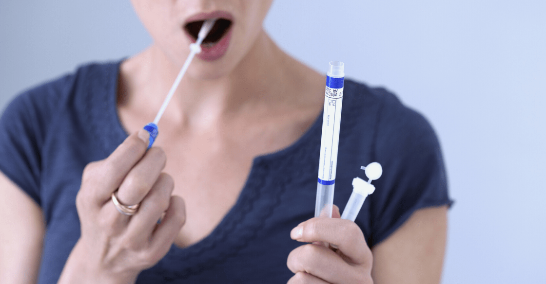 Woman taking saliva drug test