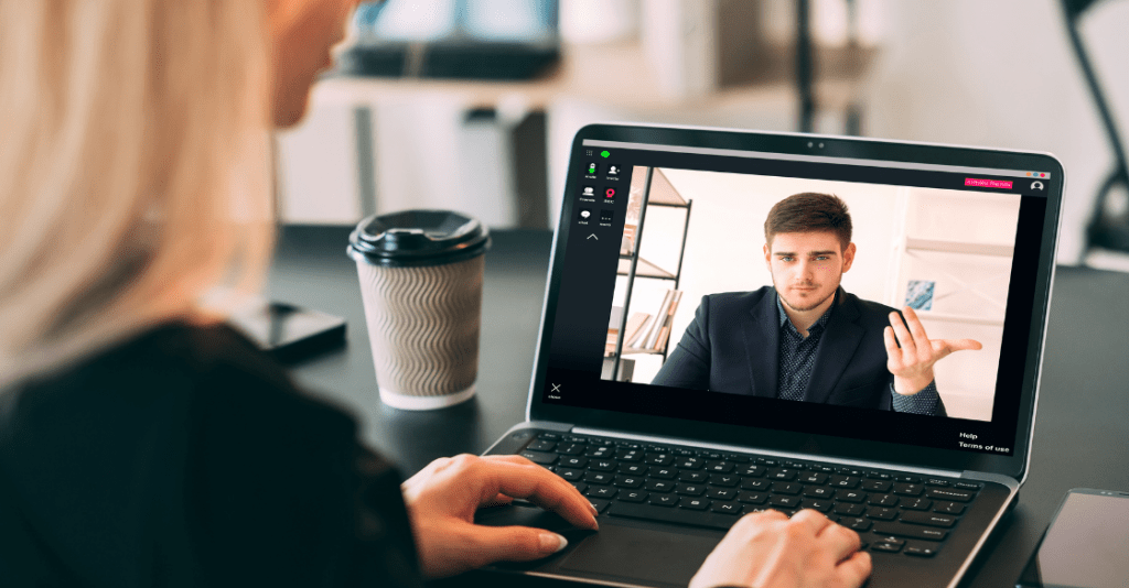 A manager rescreening a current employee over video chat.